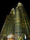 KUALA LUMPUR / MALAYSIA - 2019 : Night view of the impressive Petronas twin towers at Kuala Lumpur KLCC area Royalty Free Stock Photo