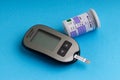 Accu Chek Performa Digital Blood Glucose Meter closeup for Diabetes on blue background