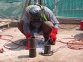 Construction workers welding pipes at the construction site. Royalty Free Stock Photo