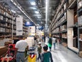 Furniture and home appliances are sold in a large warehouse.