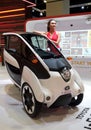 Model posed with Toyota i-ROAD concept mobility vehicles during Kuala Lumpur