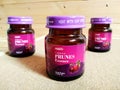 Prunes essence in labelled bottles. Royalty Free Stock Photo