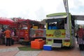 Street hawkers using food trucks to serve their business to the customer.