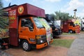 Street hawkers using food trucks to serve their business to the customer.