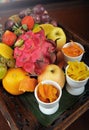 Kuala Lumpur, Malaysia - October 21, 2020 : Assorted fresh fruits in the wooden tray. strawberry, red grapes, mango, apple, oran