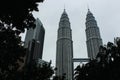 A beautiful morning sun glints off the Petronas Twin Towers and the Suria KLCC. Royalty Free Stock Photo