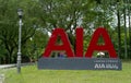 Big, red AIA logo for a famous Insurance Company is displayed in the Kepong public park