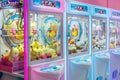 Colorful arcade game toy claw crane machine where people can win toys and other prizes