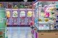 Colorful arcade game toy claw crane machine where people can win toys and other prizes which is located in the shopping mall,KL Royalty Free Stock Photo