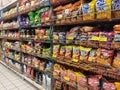 Selective focused of packed miscellaneous junk foods & snacks on rack and display for sale in the supermarket.