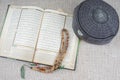 KUALA LUMPUR, 18 May 2016: The Holy Quran,Tasbih and kopiah hat. DOF and copy space