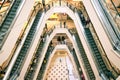 KUALA LUMPUR - NOVEMBER 12 2012: Customers riding on escalators inside Suria KLCC shopping mall at November 12, 2012.