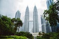 Kuala Lumpur. Petronas Twin towers and neighboring skyscrapers in golden-blue light.