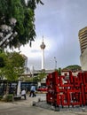 Kuala Lumpur tv tower light sun sky clouds middle perspective from city centre in asia malaysia at a bus stop