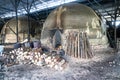 Traditional charcoal factory with big kins that bakes mangrove logs into charcoal