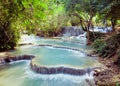 Kuangsi waterfall in deep forest in Laos Royalty Free Stock Photo