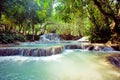 Kuangsi waterfall in deep forest in Laos Royalty Free Stock Photo