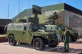 KUBINKA, RUSSIA, AUG.24, 2018: Military armored trucks Tigr equipped with air defense system and reconnaissance. Young woman in gr Royalty Free Stock Photo