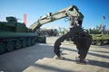 KUBINKA, RUSSIA, AUG.24, 2018: Special military excavator with toothed arm for fallen trees removing on tank platform. Russian wea