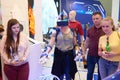 KUBINKA, RUSSIA, AUG.24, 2018: Young girl in exosuit and virtual reality glasses is trying to operate space robot on a computer si Royalty Free Stock Photo