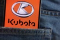 Kubota logo displayed on smartphone hidden in jeans pocket