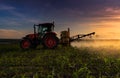 Kubota tractor in field. Royalty Free Stock Photo