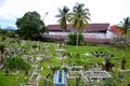 Muslim graveyard on sloping hill with Brooke Dockyard and crane Kuching Sarawak Malaysia