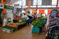 Woman customer examines and chooses fresh vegetables Satok market Kuching Malaysia