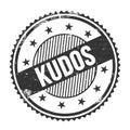 KUDOS text written on black grungy round stamp