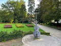 Kudowa-Zdroj, Poland - September 15 2021: A statue depicting the musical instrument bass in a beautiful park in a Polish