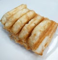 Kue Pancong or Kue Bandros or Kue Gandos, an Indonesian Street Food Snack Royalty Free Stock Photo