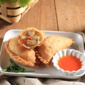 Kue Pastel Goreng Jalangkote or Karipap is Flaky Pastry Snack Filled with Cubed Carrots, Potatoes, and Eggs