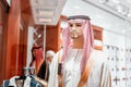 kufiya - traditional Arabic headdress on a mannequin in an Oriental fashion and clothing store in Dubai