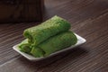 Kuih Dadar or Kuih Tayap Malaysian Pandan Crepes with Sweet Coconut Filling-Traditional food photography Royalty Free Stock Photo