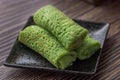 Kuih Dadar or Kuih Tayap Malaysian Pandan Crepes with Sweet Coconut Filling-Traditional food photography Royalty Free Stock Photo