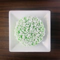 A Kuih Lopes on a white square plate.