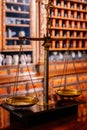 Kuks, Czech Republic, 8 October 2022: interior of historic pomegranate apple pharmacy, vintage glass bottles on wooden table,