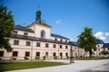 Kuks, East Bohemia, Czech Republic, 10 July 2021: Baroque castle and hospital Kuks, courtyard with antique sundial on the facade,