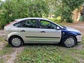 Kuldiga, Latvia - August 3, 2022: Ford Focus car in silver color with with different colored front wings