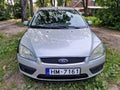 Kuldiga, Latvia - August 3, 2022: Ford Focus car in silver color with with different colored front wings