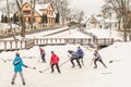 Kuldiga, Latvia - January 7, 2017: Children play ice hockey on the park pond in winter day Royalty Free Stock Photo