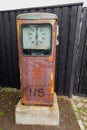 Kuldiga, Latvia - July 27, 2022: Antique, rusty gasoline pump as decoration