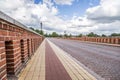 Kuldiga, Latvia - July 3, 2023: Kuldigas old brick bridge across the Venta river was built in 1874 and is the longest