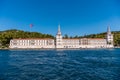 Kuleli Military High School building with tower and flags of Turkey on seashore of Bosphorus strait, Istanbul, Turkey