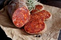 Kulen. Croatian spicy sausage on wooden board Royalty Free Stock Photo