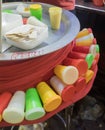 Kulfi is a frozen dairy dessert being sold in a market of india. colorful containers of the kulfi kept outside the main pot.this Royalty Free Stock Photo
