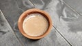 A kulhar or kulhad cup traditional handle-less clay cup from North India filled with hot Indian tea