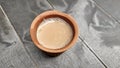 A kulhar or kulhad cup traditional handle-less clay cup from North India filled with hot Indian tea