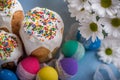 Kulich, traditional Russian Ukrainian Easter cake with colored eggs and flowers Royalty Free Stock Photo