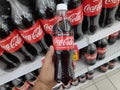 KULIM,MALAYSIA - CIRCA OCTOBER,2019 : A hand holding a bottle of Coca Cola No Sugar at supermarket